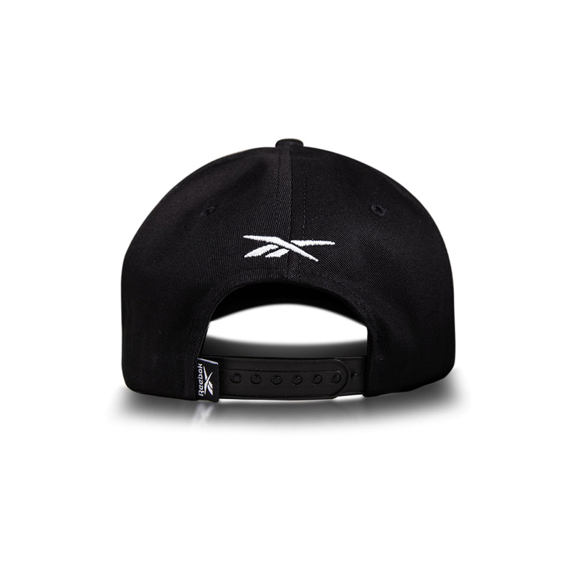 The Reebok Gameday Cap, shown from the back, features a white Reebok logo and an adjustable snapback closure. This black, vintage-inspired baseball cap is set against a plain white background.