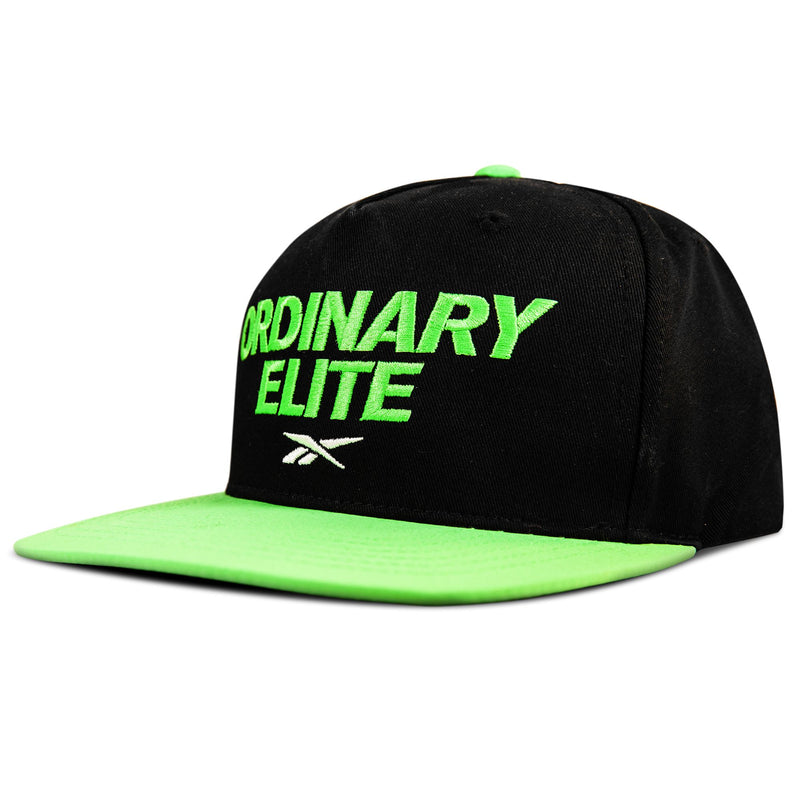The Reebok Ordinary Elite Cap is a black snapback with a cotton crown, bright green brim, and green "ORDINARY ELITE" text above a white logo—combining comfort and standout style in an adjustable fit.