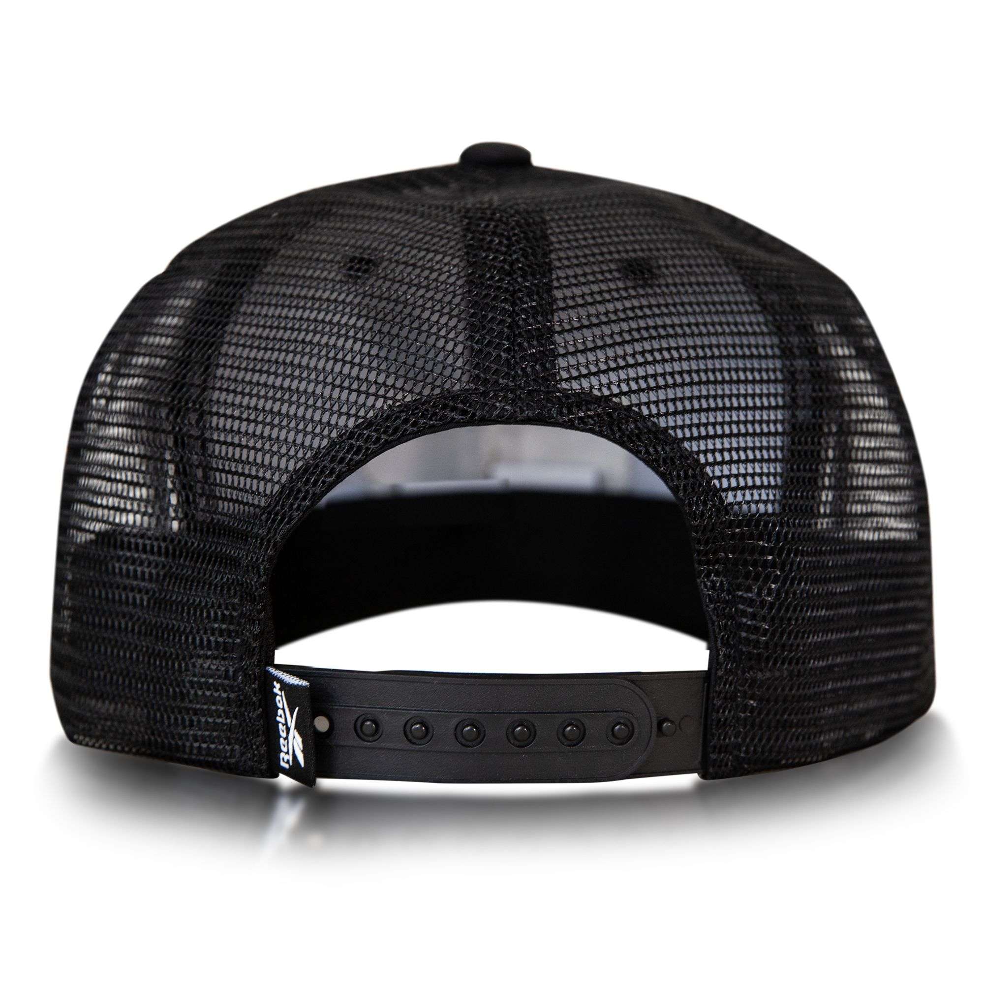 A black mesh snapback seen from the back, the Reebok Basketball Trucker Cap features an adjustable plastic closure—combining sporty style with classic trucker comfort.