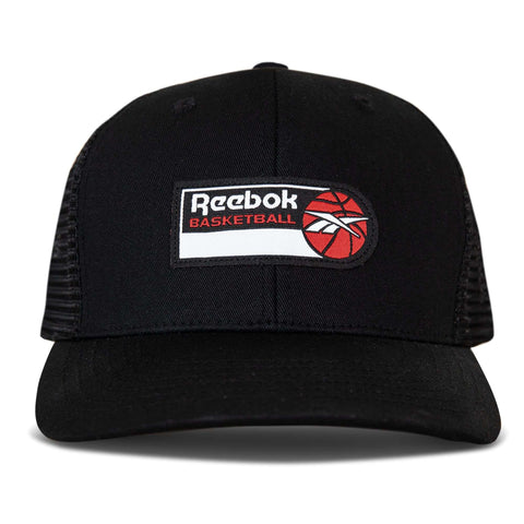 The Basketball Trucker Cap by Reebok features a black design, front patch with the Reebok logo, BASKETBALL in orange, and a basketball graphic—a snapback hat perfect for fans.