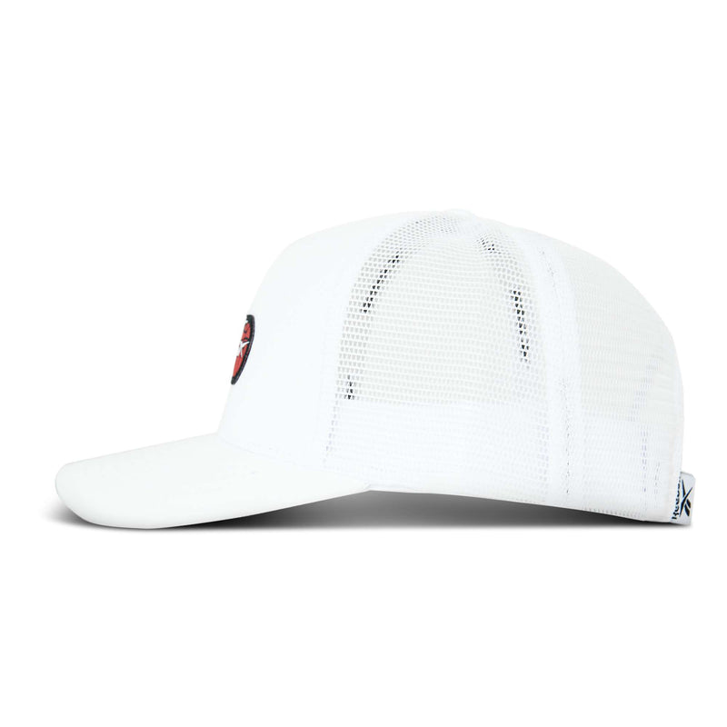 Side view of a white Reebok Basketball Trucker Cap with a curved brim and front embroidered patch. Features breathable mesh back panels, adjustable snapback closure, and fabric tag at the back.