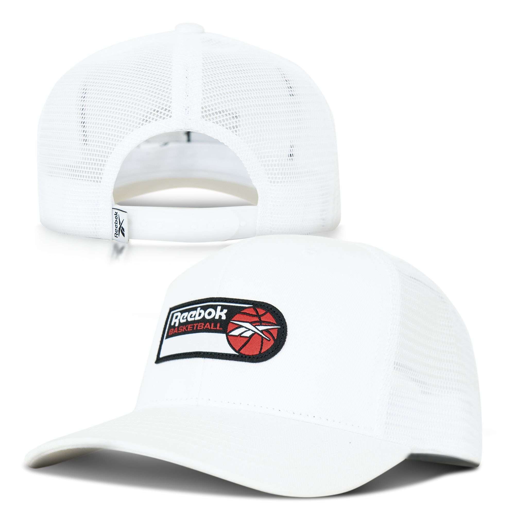 The Reebok Basketball Trucker Cap is shown from the front and back, featuring a basketball patch graphic on the front and an open adjustable snapback strap for comfort.