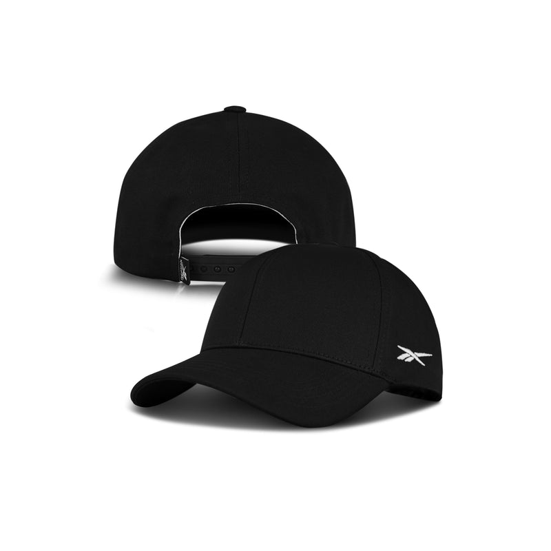 The Reebok Chroma Cap is shown from the front, with a small white Reebok logo, and from the back, highlighting its adjustable snapback closure. This cotton twill cap appears against a clean white background.
