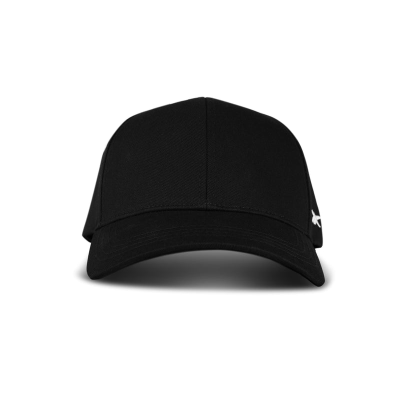 A front view of the Reebok Chroma Cap in plain black cotton twill, featuring a slightly curved brim, small white side logo, and adjustable snapback, set against a white background.