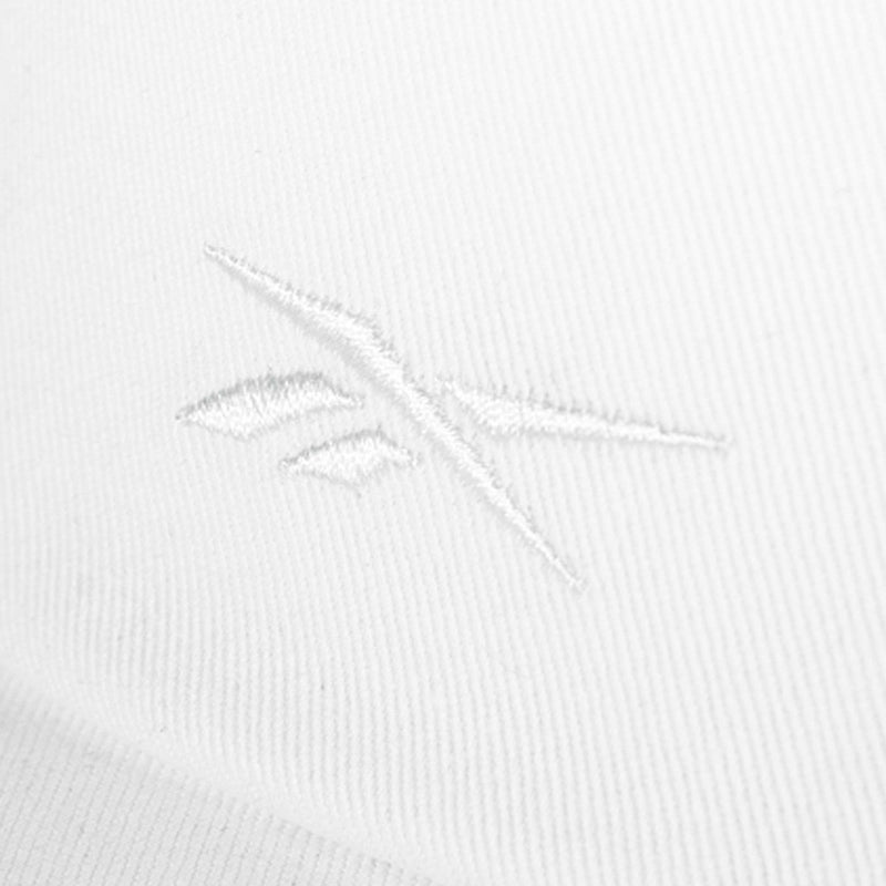 Close-up of a white cotton twill Reebok Logo S-Vector Cap, featuring a subtle, embroidered Reebok logo in matching white thread for a minimalist, textured look.