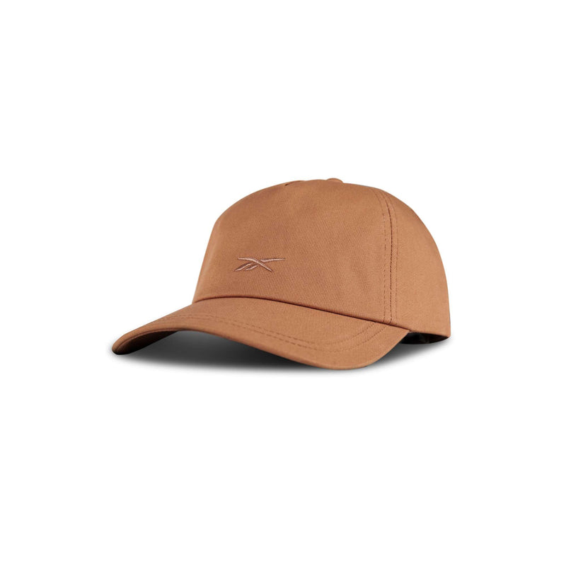 The Reebok Logo S-Reebok Vector Cap features a tan color, curved brim, and subtle embroidered front logo, shown on a plain white background.