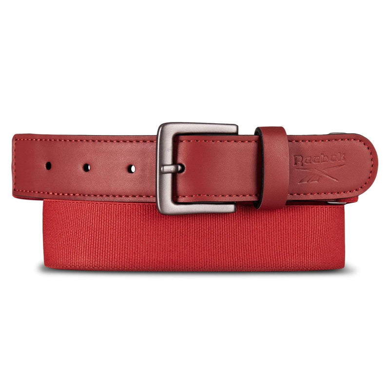 A Reebok Youth Baseball Belt in red with a silver buckle is shown atop a red box, featuring the Reebok logo near the end and an adjustable design for a secure fit.