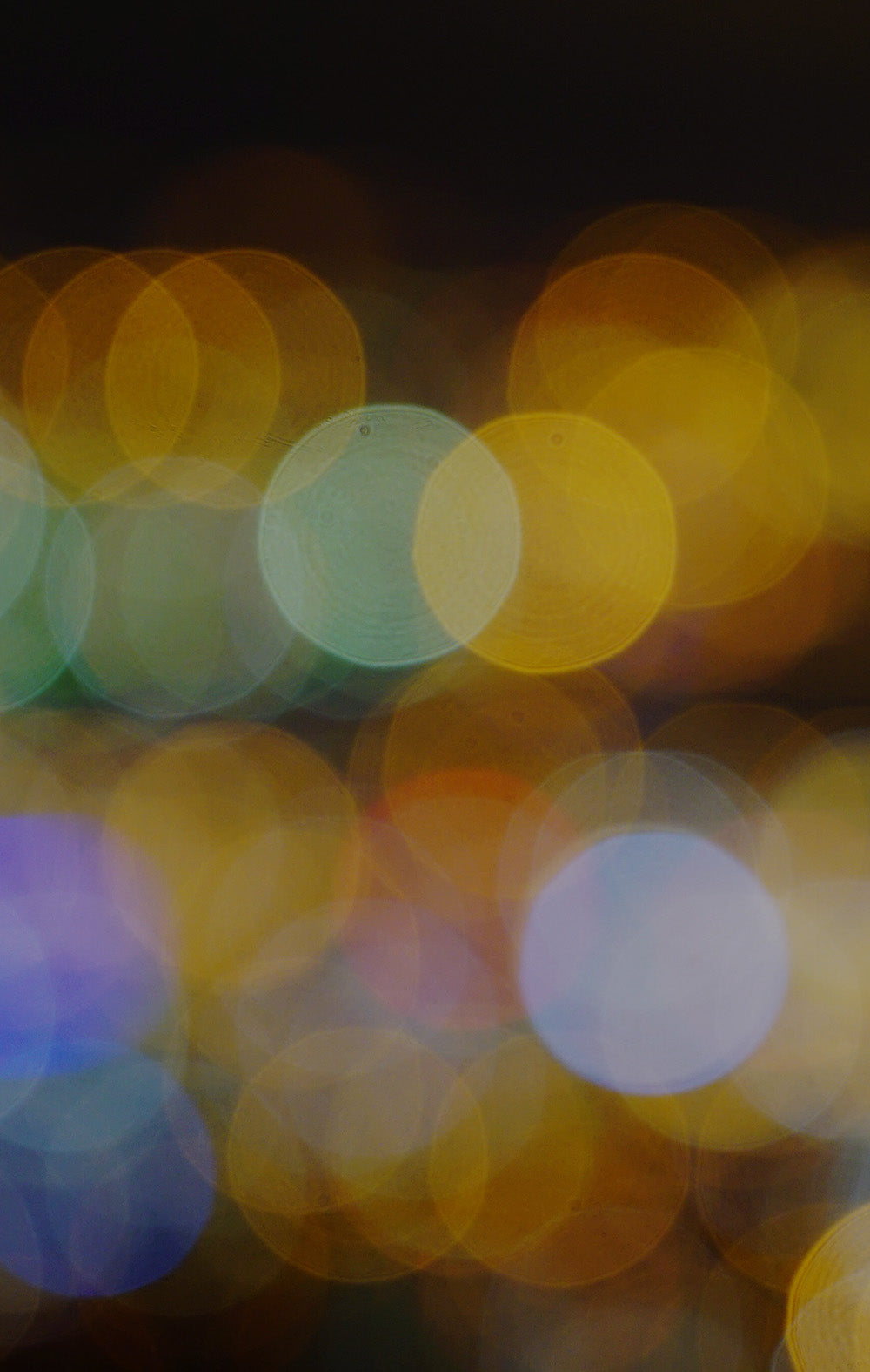 Blurred colorful lights on a dark background