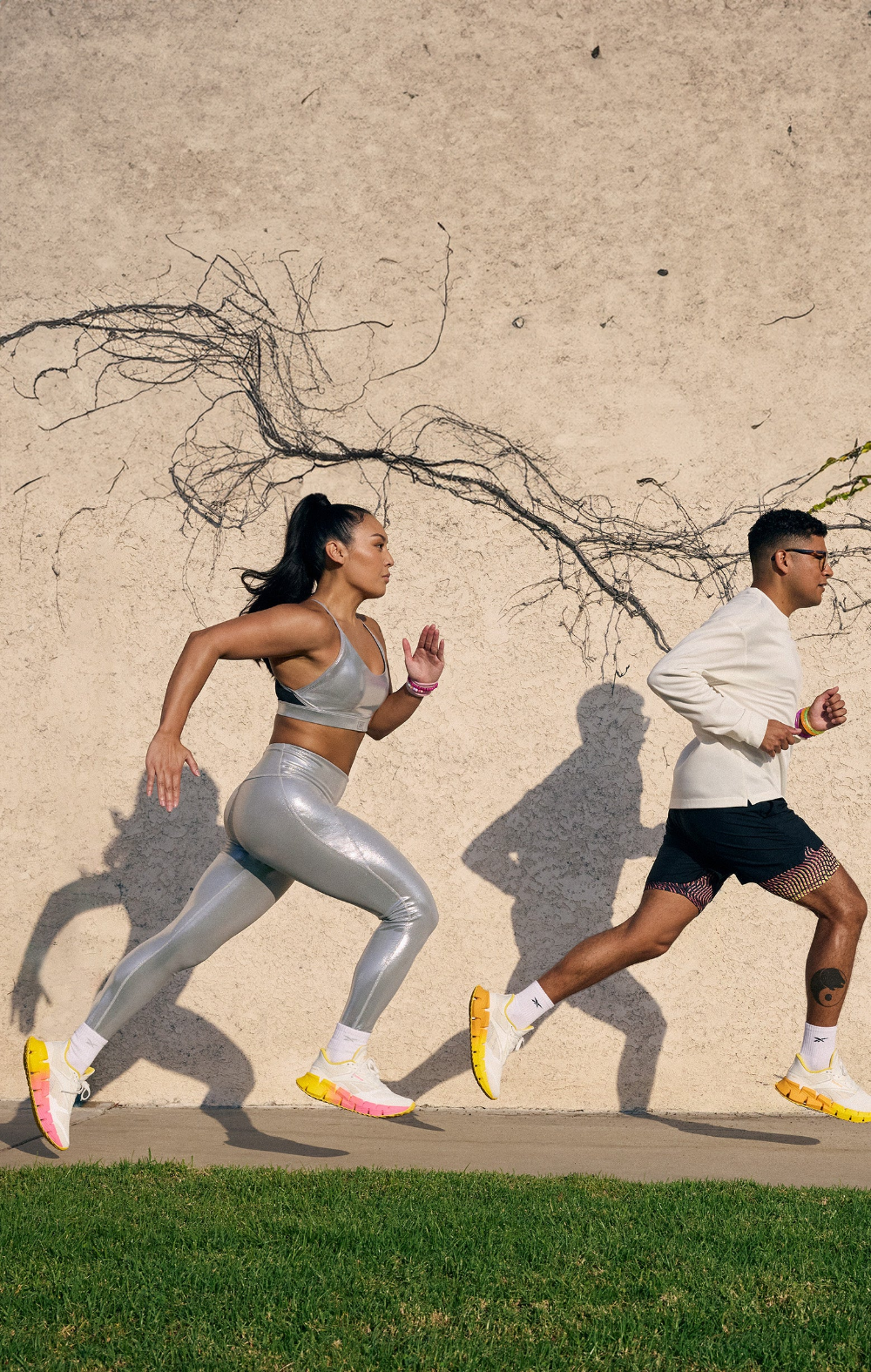 Man and woman running in FloatZig shoes