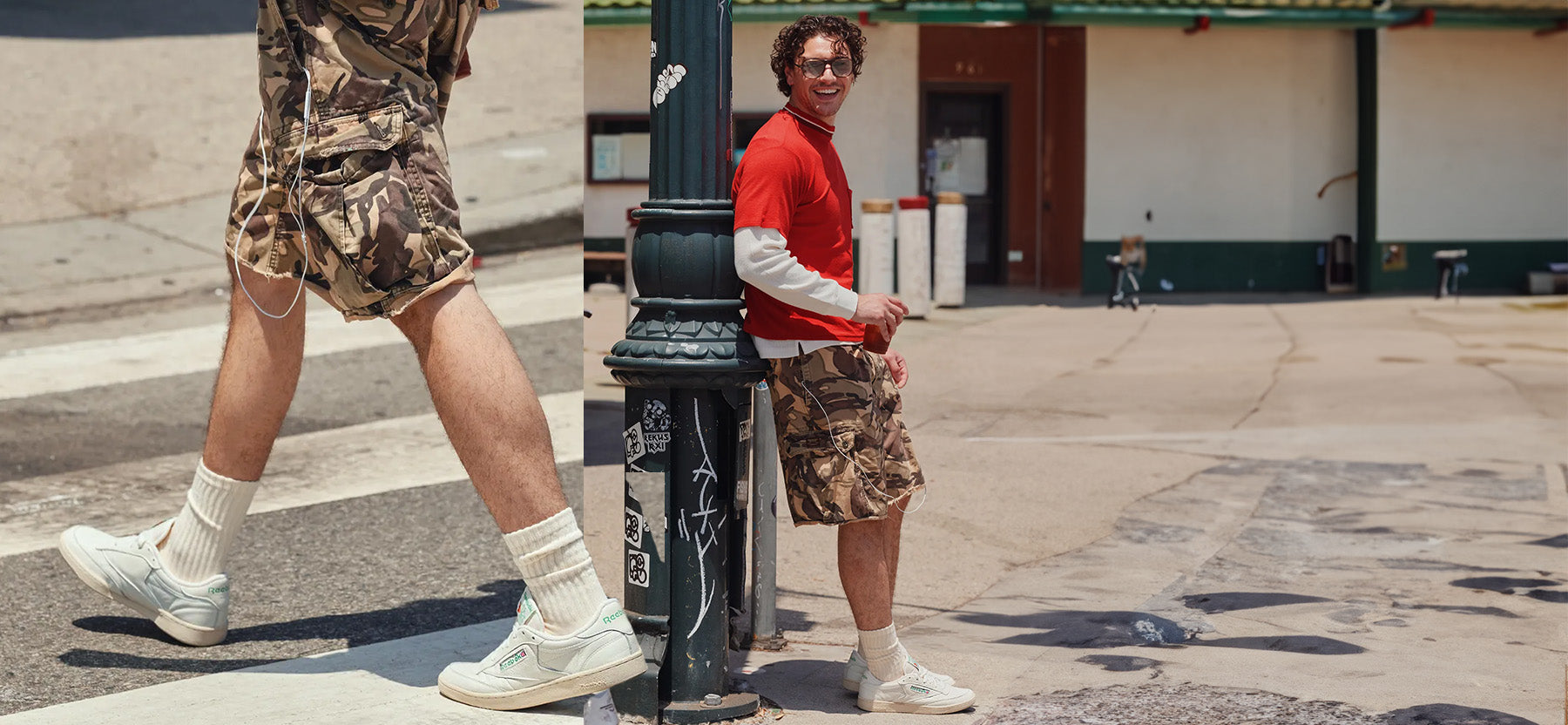 A split-screen lifestyle image showing a model wearing camouflage cargo shorts, white crew socks, and white sneakers in an outdoor street setting. The left half shows a close-up of the model's legs walking past a pole, while the right half shows the full model wearing a red turtleneck over a white long-sleeve shirt, sunglasses, and camouflage shorts leaning against a black pole.