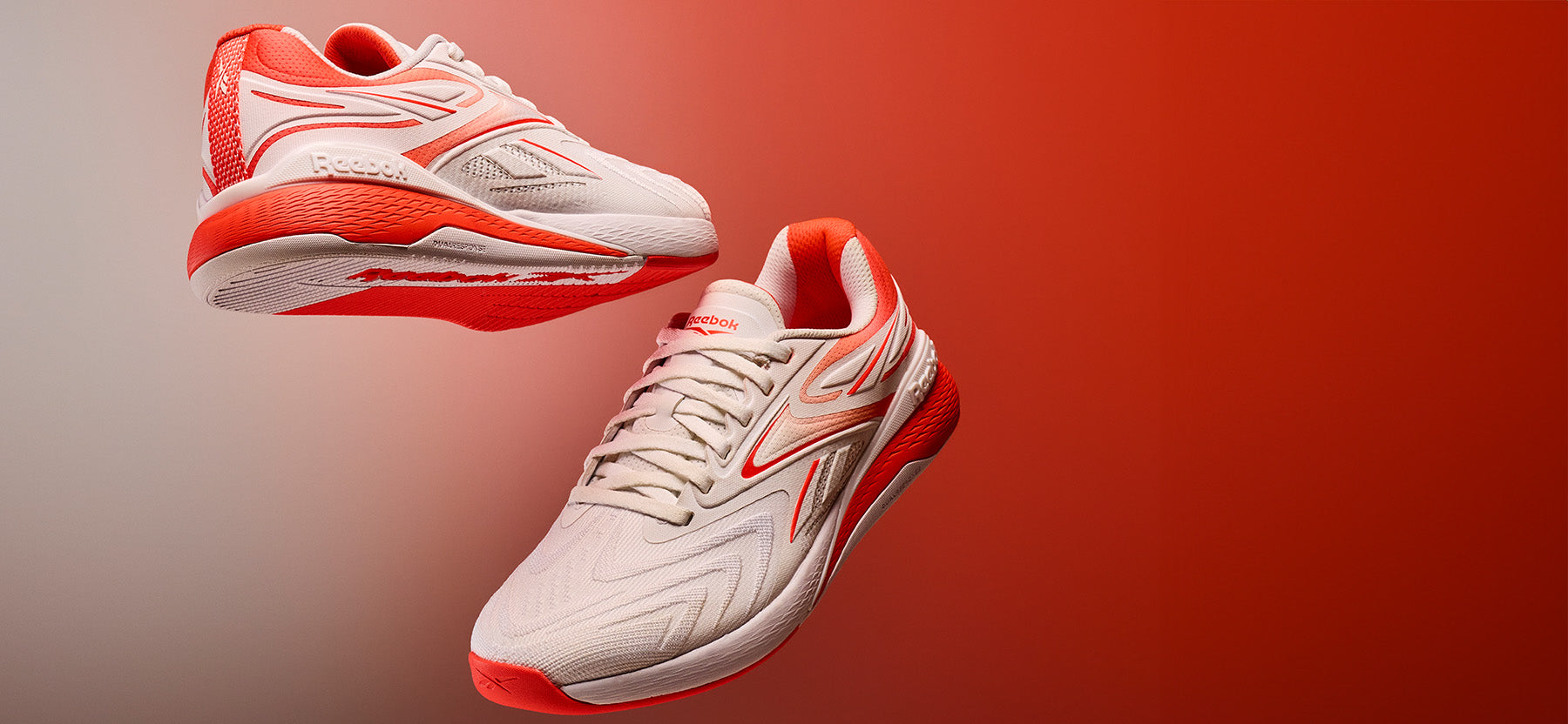 white and red basketball shoes on a red background