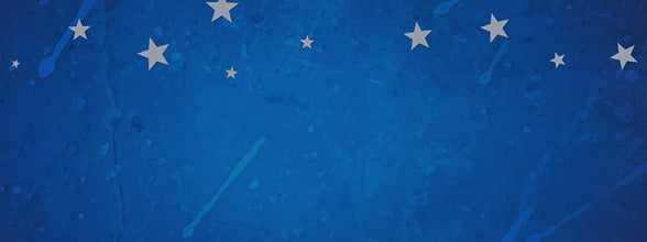 A textured blue background featuring scattered white stars of various sizes, with subtle streaks and splatters adding visual interest.