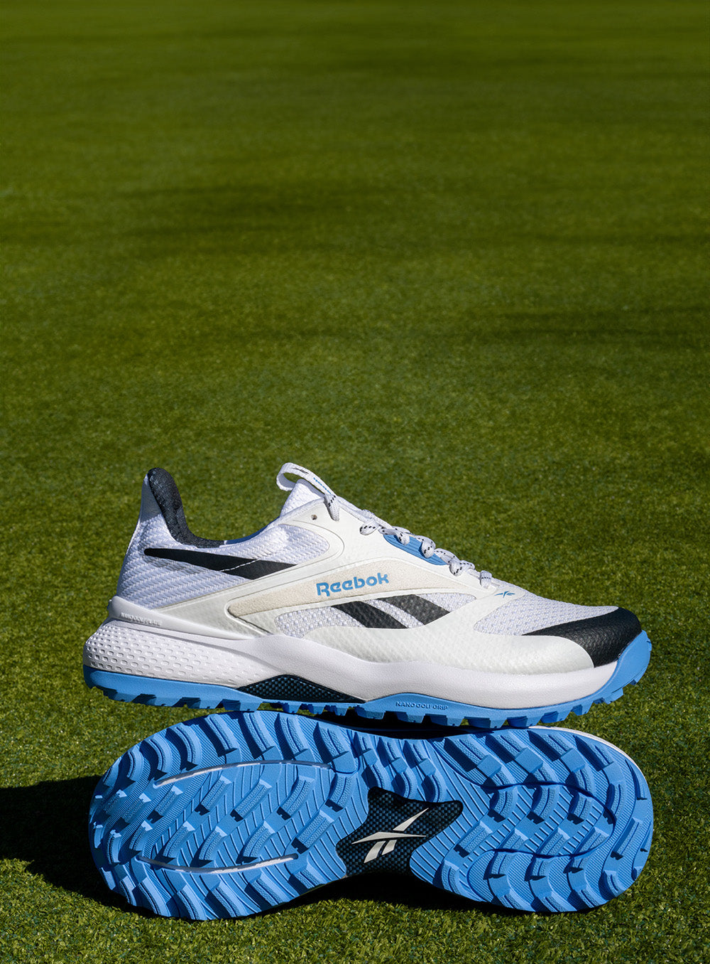 Reebok running shoes on a grassy field