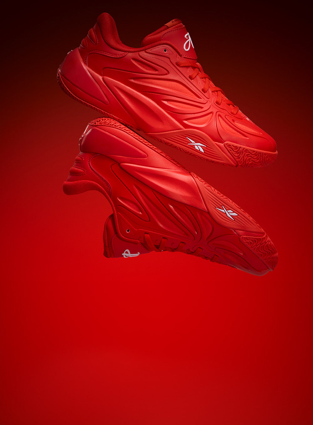 red basketball shoes on a red and black background