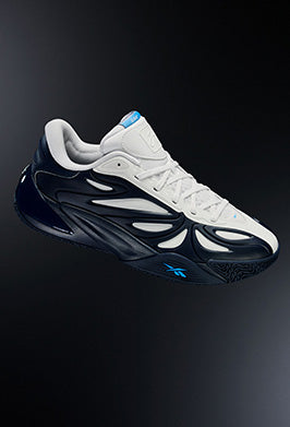 Black and white sneaker with blue accents on a dark background