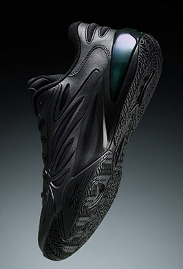 Black sneaker with unique design on a gradient background