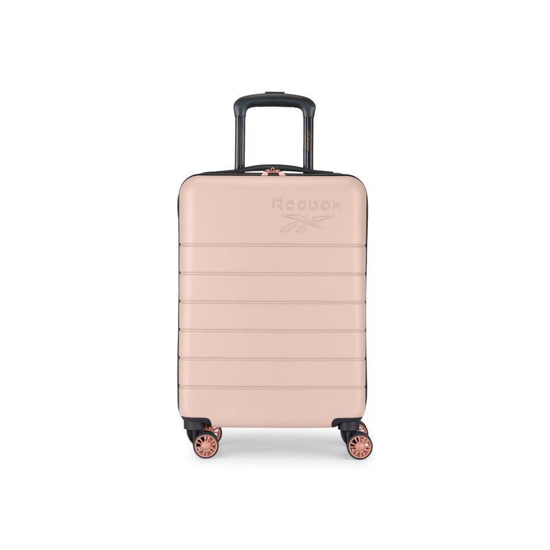 A rose gold hard-shell suitcase with four wheels and a black retractable handle, featuring the Reebok logo embossed on the front. The suitcase is photographed against a white background.