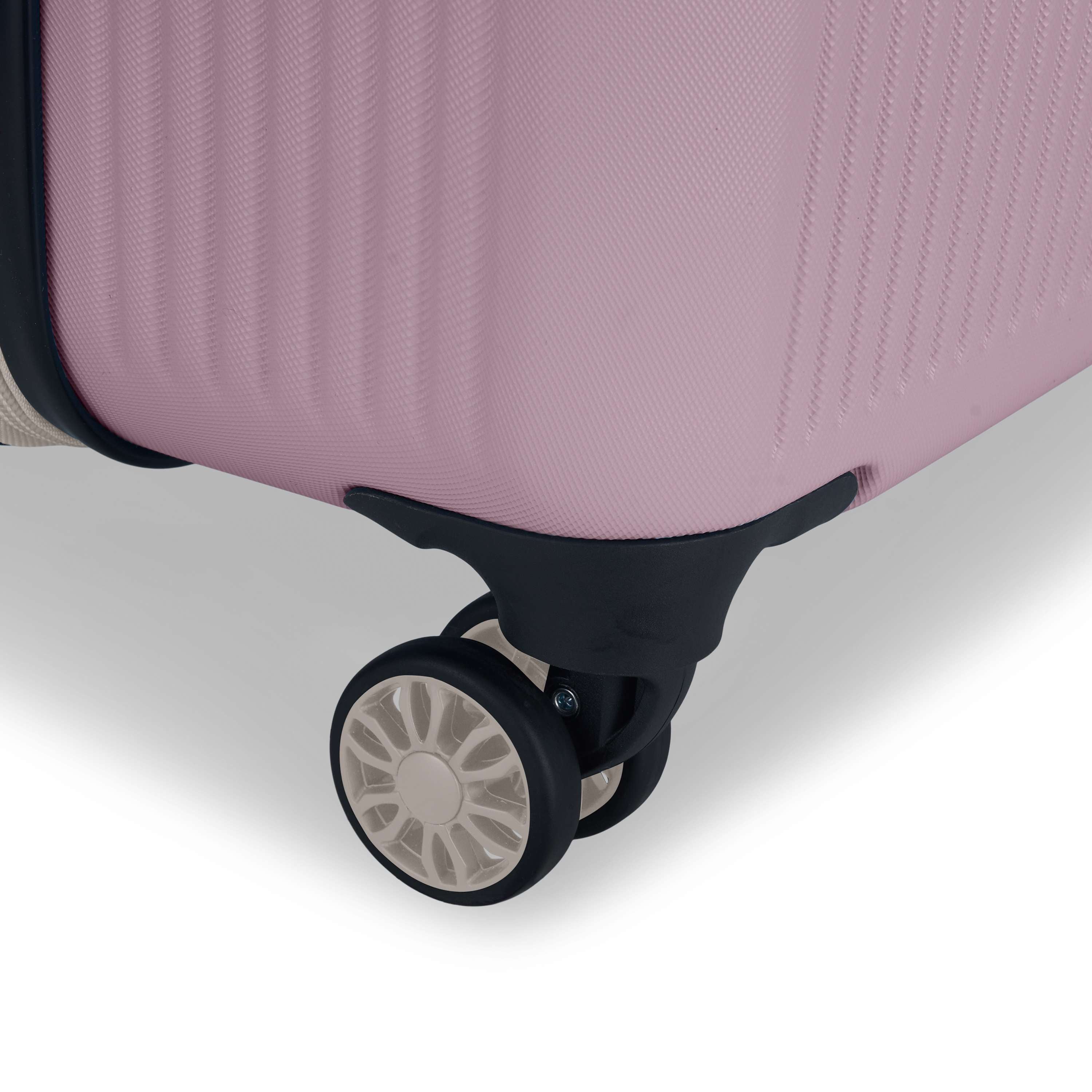 Close-up of the Reebok Action Duo 2 Piece Luggage Set in pink, highlighting the black and white spinner wheel on the lower corner and showcasing its textured surface.