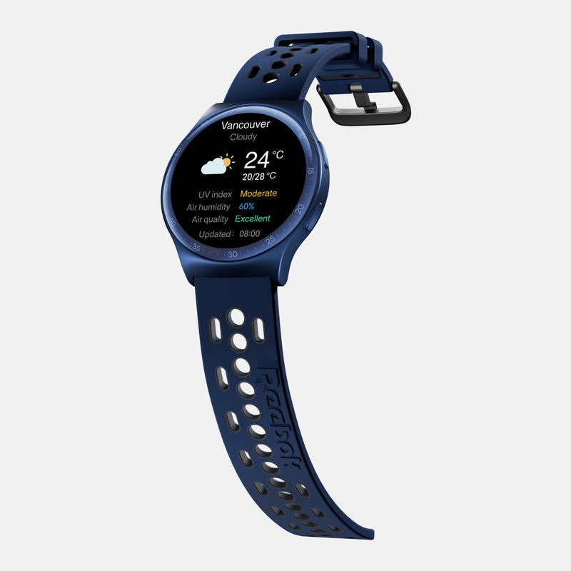 The Reebok Pulse Smartwatch by Reebok features a blue perforated strap and displays Vancouver weather—24°C, cloudy, moderate UV, 66% humidity, excellent air quality—on its round screen. It also provides advanced fitness tracking capabilities.