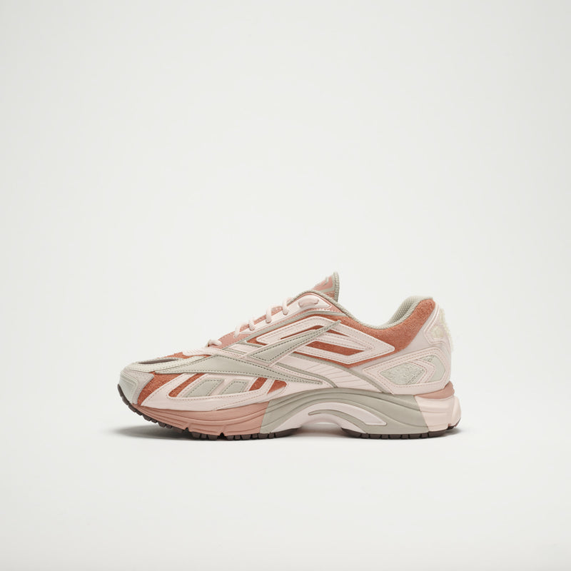 The Reebok Premier Road Ultra LTD Shoes in beige, light pink, and light brown feature a chunky sole, dual-density midsole, and layered materials, shown on a plain white background.