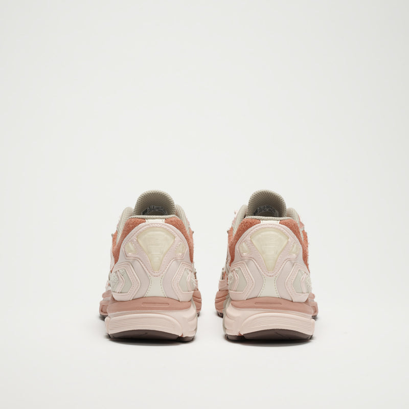 A pair of Reebok Premier Road Ultra LTD Shoes in pink and beige is displayed from the back on a plain white background.