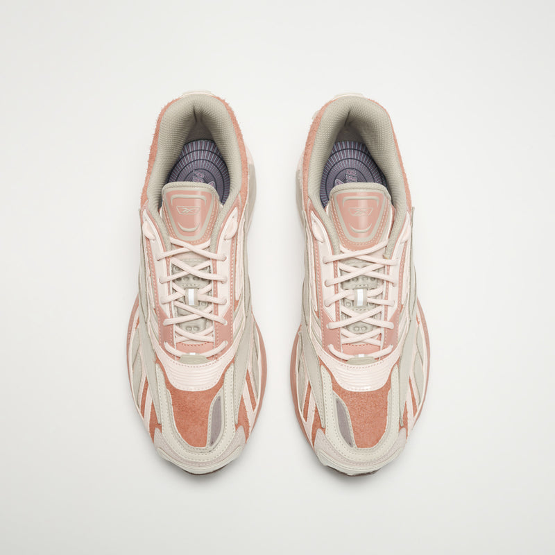 A pair of Reebok Premier Road Ultra LTD Shoes in pink and white with light gray accents and a dual-density midsole, shown from above on a plain white background.