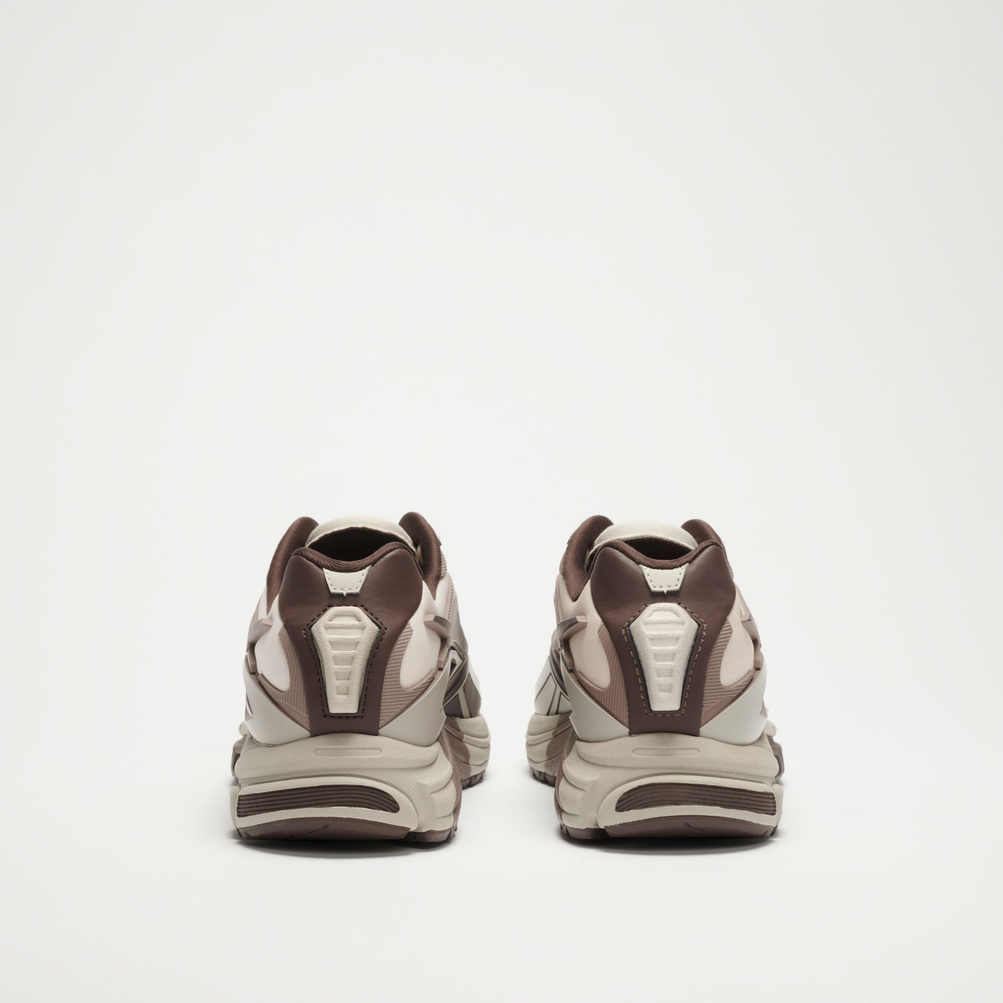 A pair of Reebok Premier Road Modern LTD Shoes in brown and beige, viewed from the back against a plain white background.