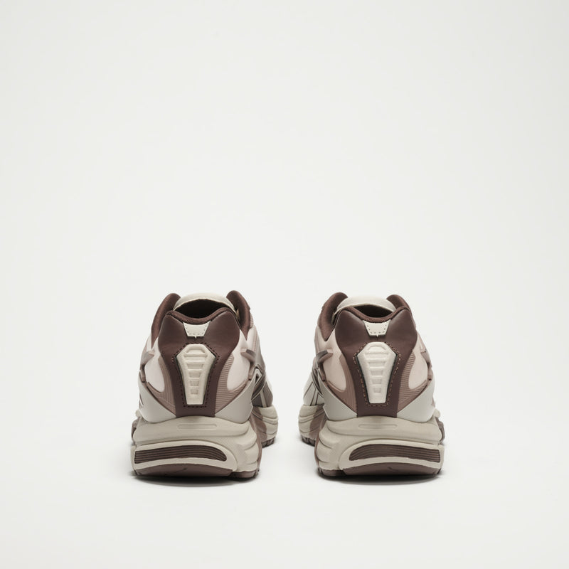 A pair of Reebok Premier Road Modern LTD Shoes in brown and beige, viewed from the back against a plain white background.