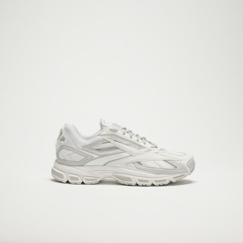 The Reebok Premier Road Ultra LTD Shoes are white running sneakers with mesh and synthetic overlays, shown in a side view on a plain white background.