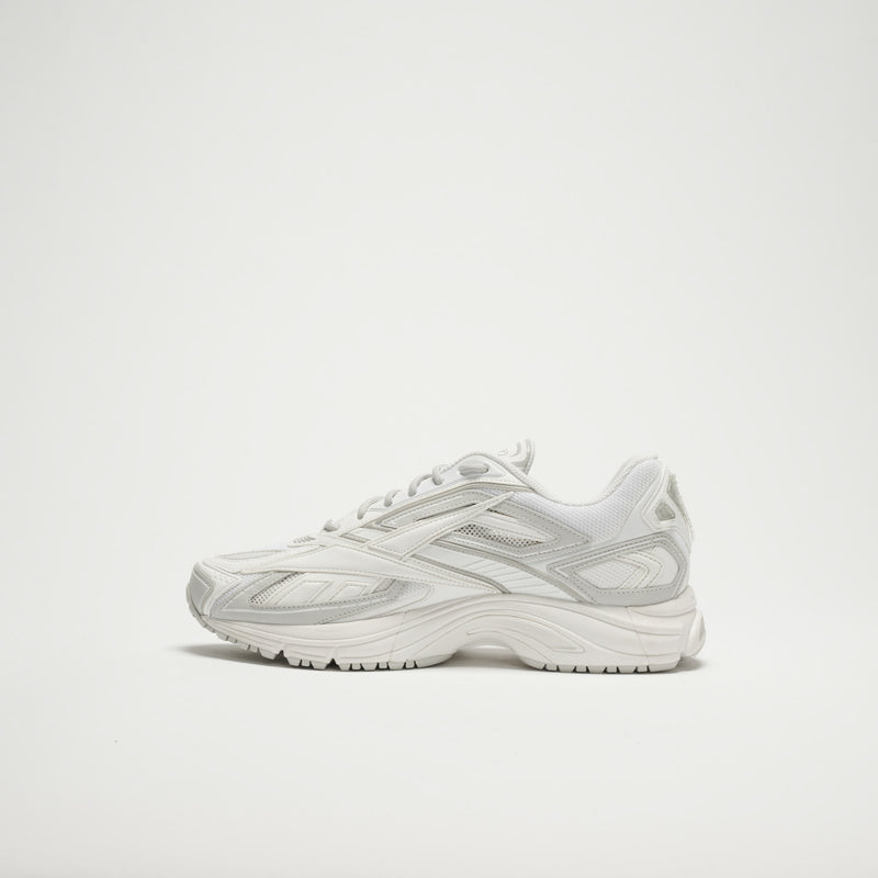The Reebok Premier Road Ultra LTD Shoes are white with mesh and synthetic overlays, a chunky sole, and dual-density midsole, shown in profile on a plain white background.