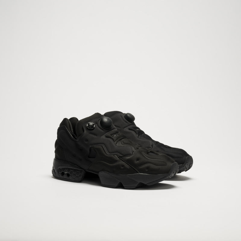 The Reebok Instapump Sliver LTD Shoes are all-black athletic sneakers with a textured futuristic design, chunky soles, and Hexalite cushioning, shown against a plain white background.