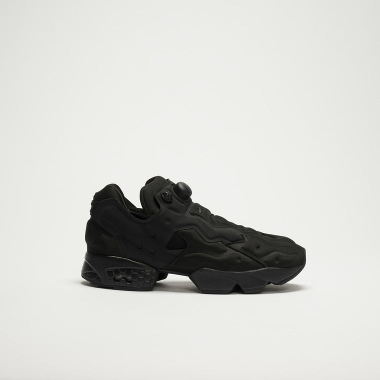The Reebok Instapump Sliver LTD Shoes, in black with a chunky futuristic sole and pump mechanism, feature advanced Hexalite cushioning and are shown against a plain white background.