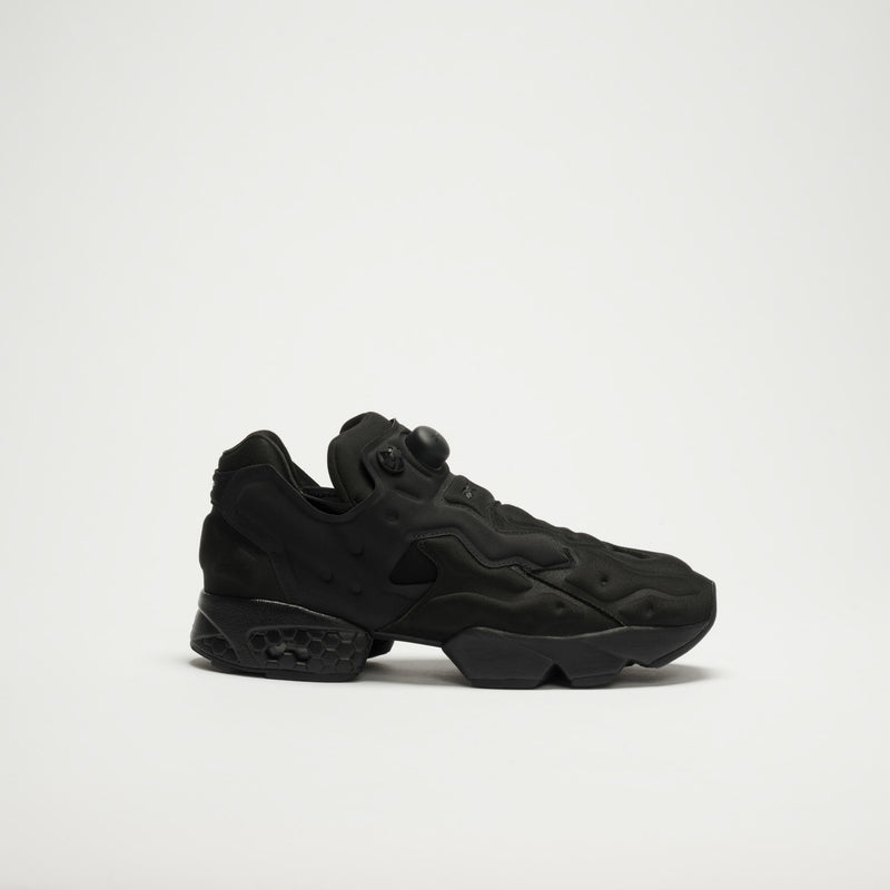 The Reebok Instapump Sliver LTD Shoes, in black with a chunky futuristic sole and pump mechanism, feature advanced Hexalite cushioning and are shown against a plain white background.