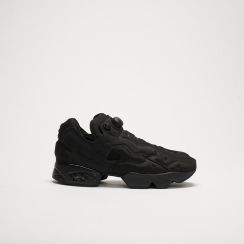 The Reebok Instapump Sliver LTD Shoes feature a futuristic black design with sculpted panels, a chunky sole with Hexalite cushioning, and an air pump system on the upper, displayed against a plain white background.