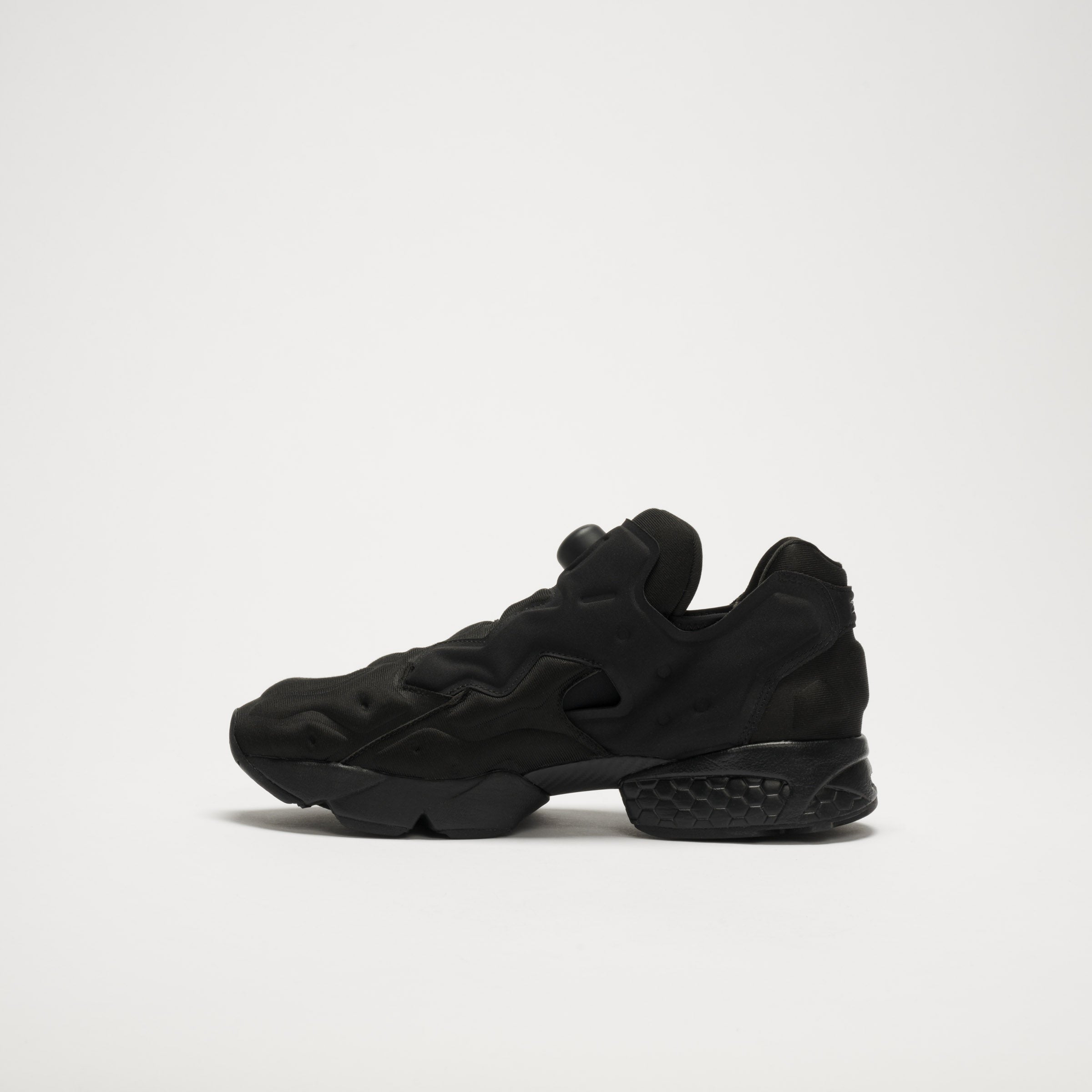 The Reebok Instapump Sliver LTD Shoes are black athletic sneakers with a chunky, sculpted sole and Hexalite cushioning, shown facing left on a plain white background with no visible branding.