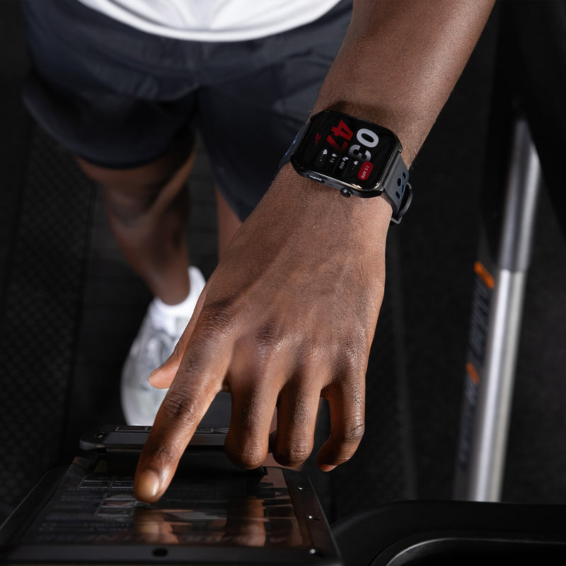 Person using an exercise screen with a smartwatch on their wrist