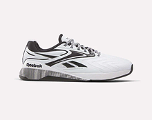 A white Reebok athletic shoe with black and silver accents, featuring the Reebok logo on the side and heel, displayed on a light background.