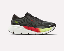 A black athletic shoe with a thick white sole, featuring red and yellow gradient accents on the midsole and subtle green detailing near the heel.