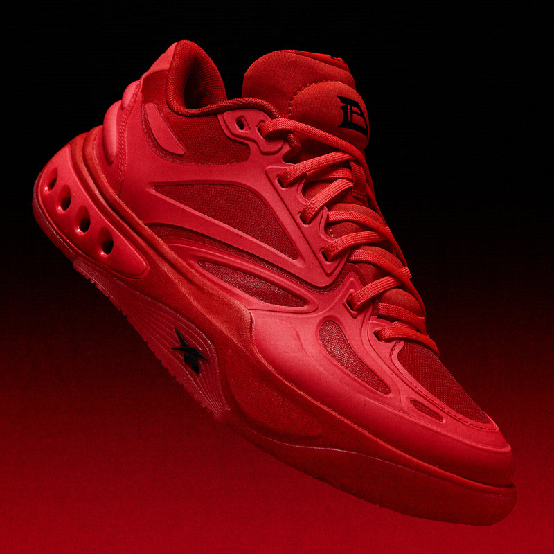 Bright red Reebok Engine A basketball shoes featuring a textured sole and mesh panels.