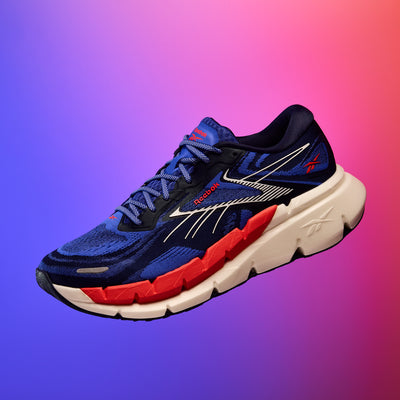 Blue and red running shoe on a gradient background