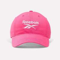 Pink Reebok cap on a light gray background