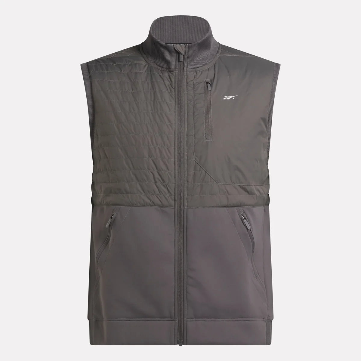 A sleeveless, gray zip-up vest with a high collar, quilted upper section, two zippered side pockets, a zippered chest pocket, and a small Reebok logo on the left chest.