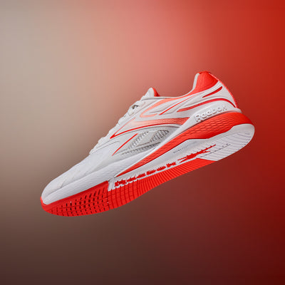 White and red sneaker on a gradient background