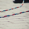 People playing double Dutch while wearing black CELINE Reebok Freestyle Lo shoes.