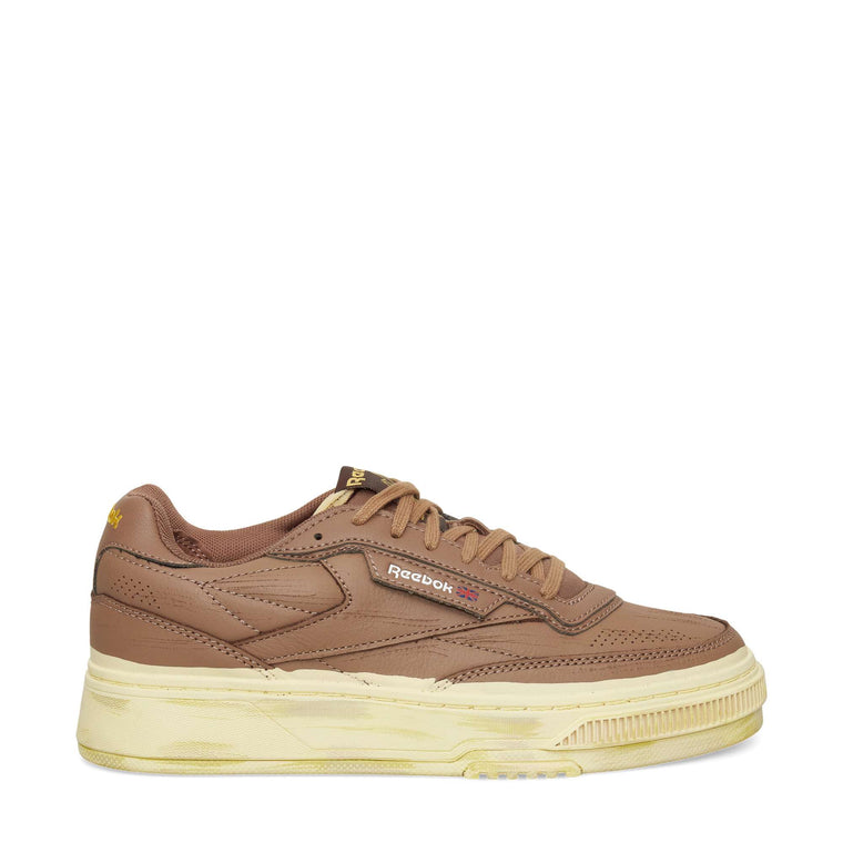 The Reebok Club C LTD Shoes feature a brown upper, chunky beige-cream sole, classic side branding, and brown laces. Shown in side profile, these tennis-inspired sneakers appear against a plain white background.
