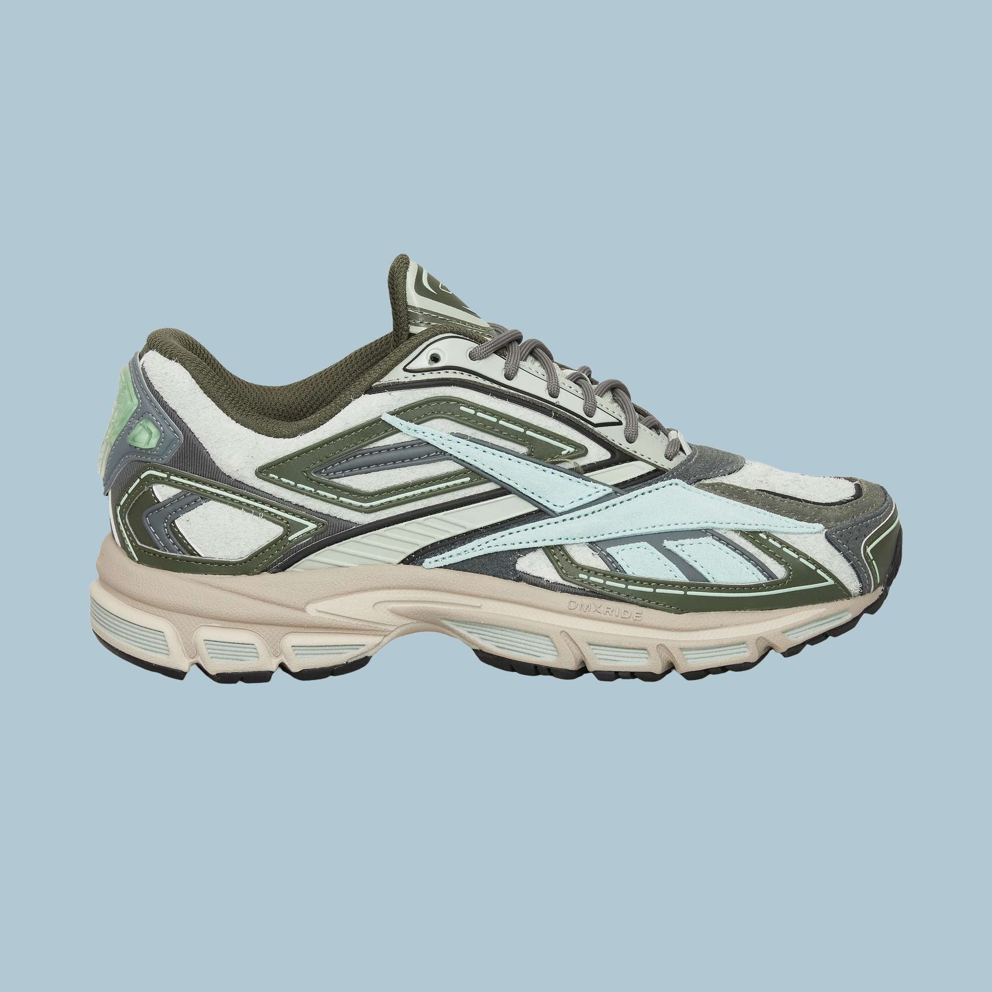 The Reebok Premier Road Ultra Shoes feature a layered design in light blue, olive green, beige, and white with a textured sole and dual-density midsole, showcased against a solid light blue background.