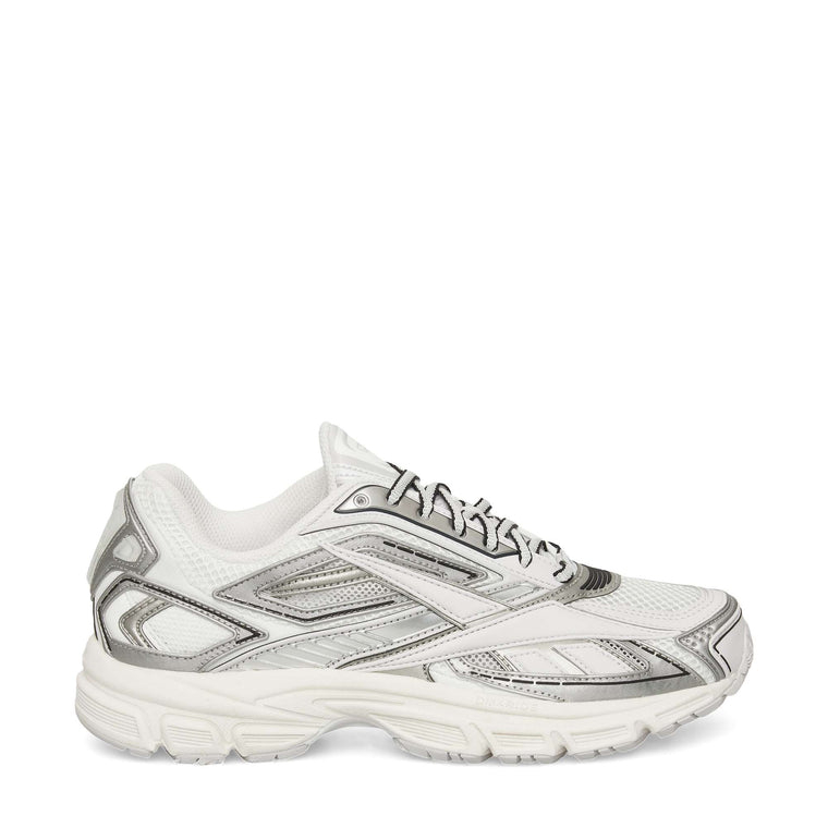 The Reebok Premier Road Ultra Shoes in white with silver and gray accents feature a mesh upper, lace-up closure, and thick textured sole. This archival sneaker is displayed from a side profile against a plain white background.