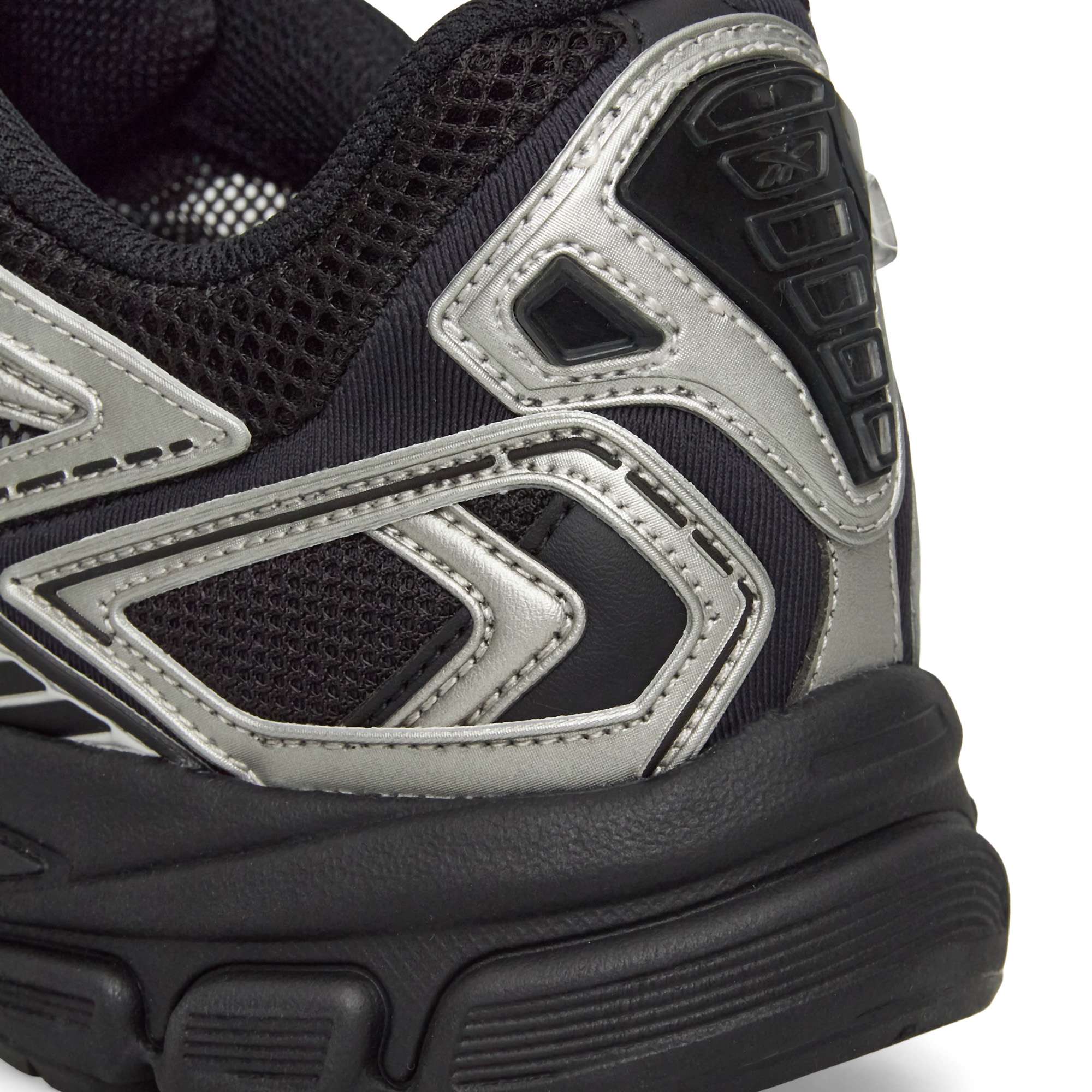Close-up of the heel and side of Reebok Premier Road Ultra Shoes, featuring silver and gray accents, a textured mesh upper, and a thick, sculpted dual-density midsole.