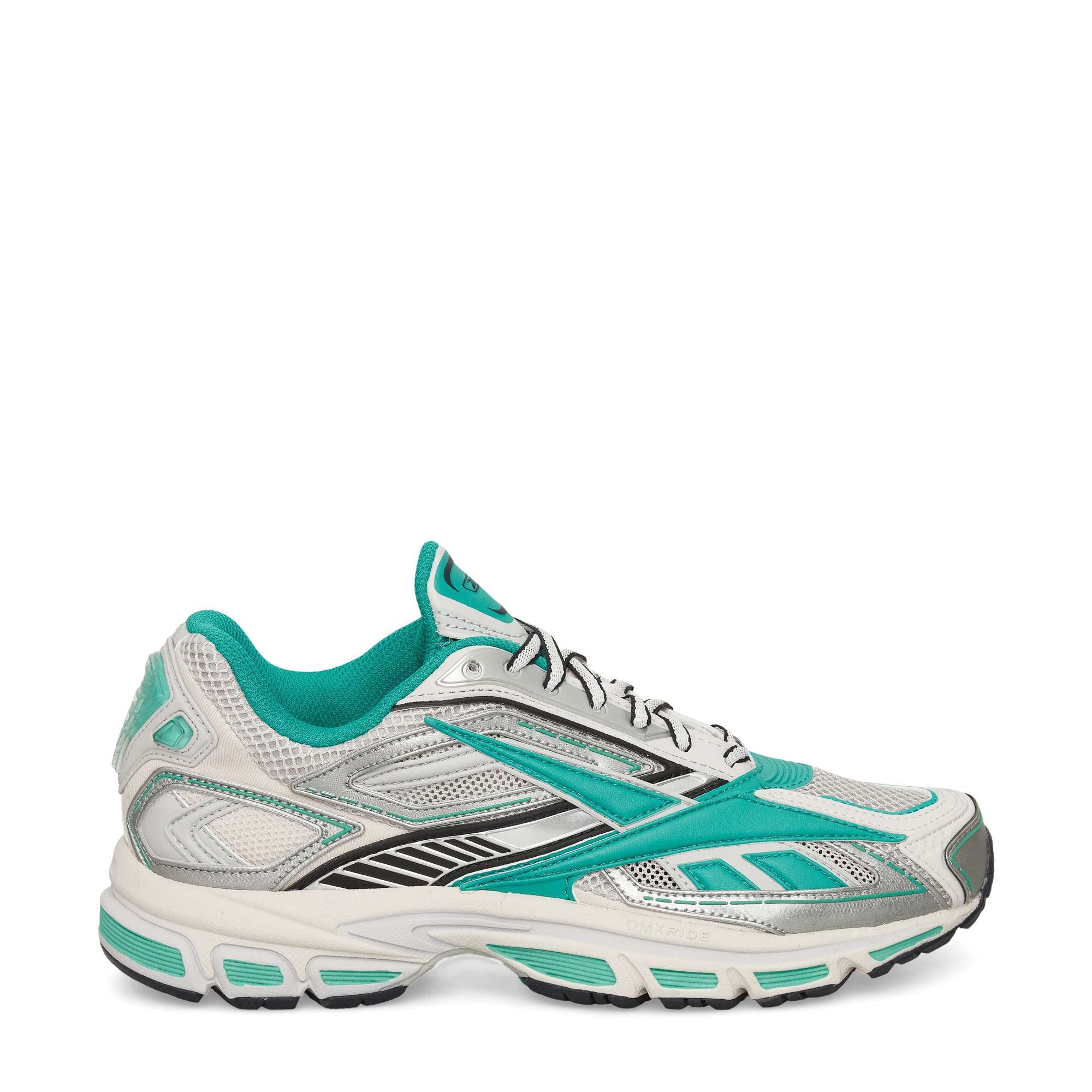 A white athletic running shoe with teal accents, silver and black detailing, mesh fabric, a chunky cushioned sole, and teal lining, shown in a side profile on a plain white background.
