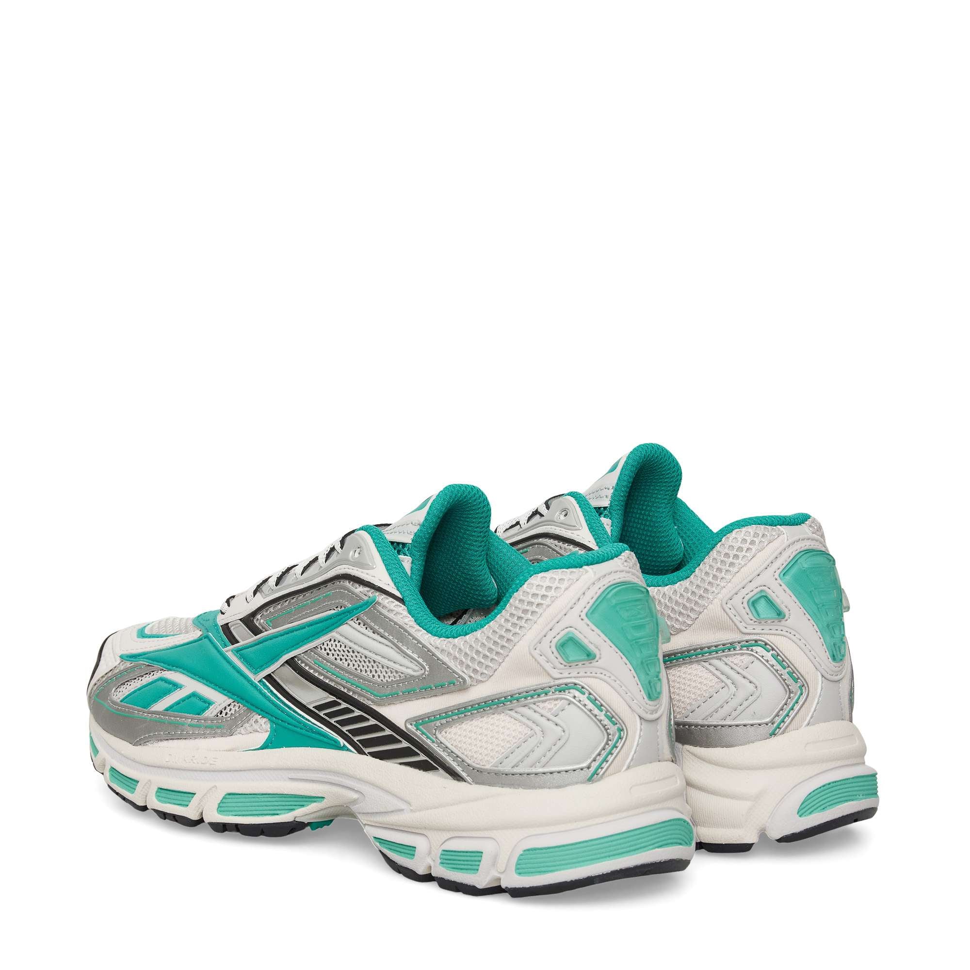 A pair of athletic sneakers in white with teal and silver accents, viewed from the back and side, showing mesh panels, padded collars, and textured rubber soles.